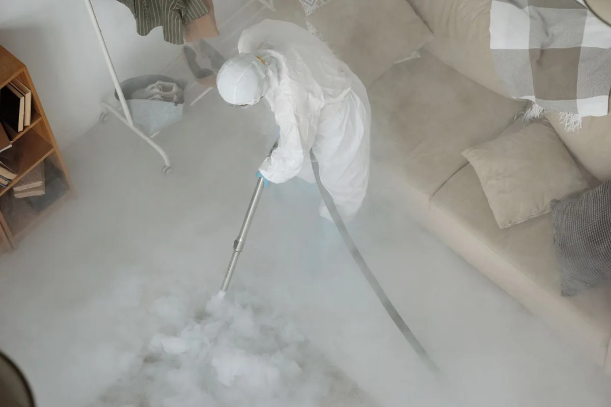 Biohazard cleanup technician in protective equipment, Nassau Village-Ratliff, FL